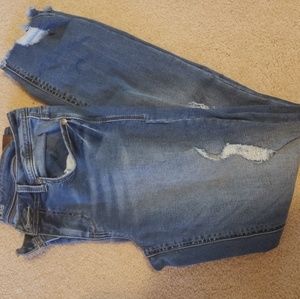 Jeans with distressed ankles